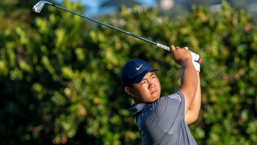 Tom Kim hits his tee shot