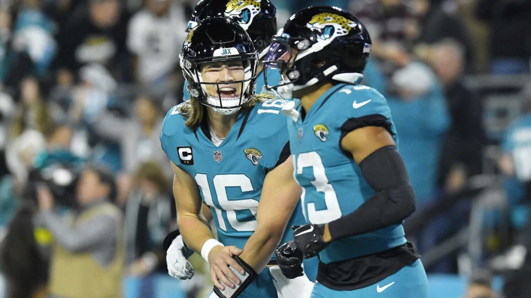 Trevor Lawrence celebrating with Christian Kirk
