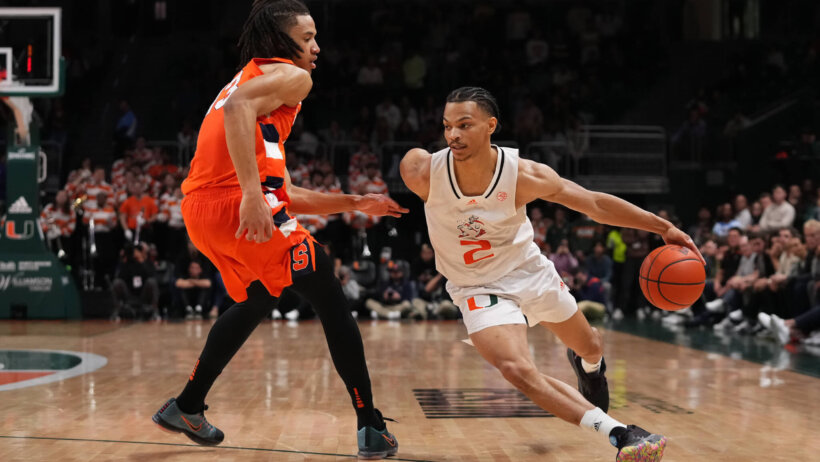 Isaiah Wong drives the ball around Syracuse Orange forward Benny Williams.