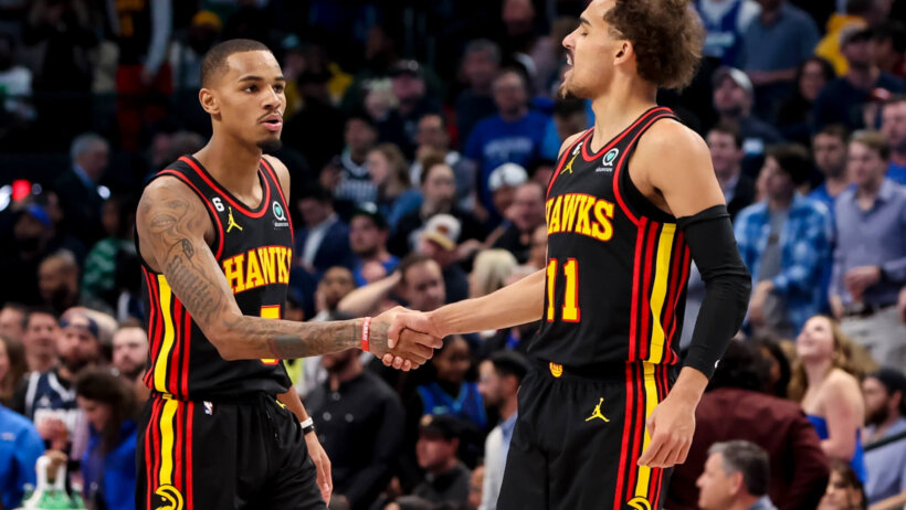 Trae Young and Dejounte Murray shake hands