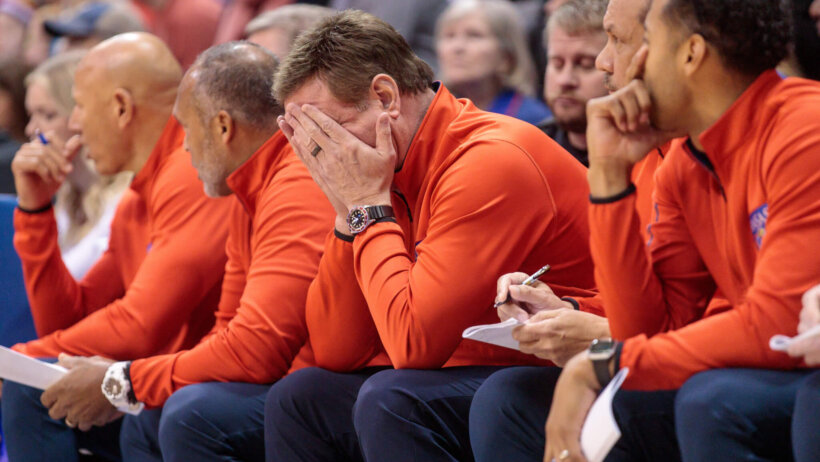 Kansas Jayhawks coach Bill Self puts his head in his hands
