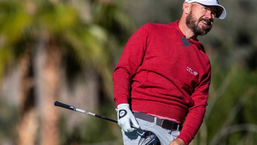 Brian Harman watches his tee shot go off line