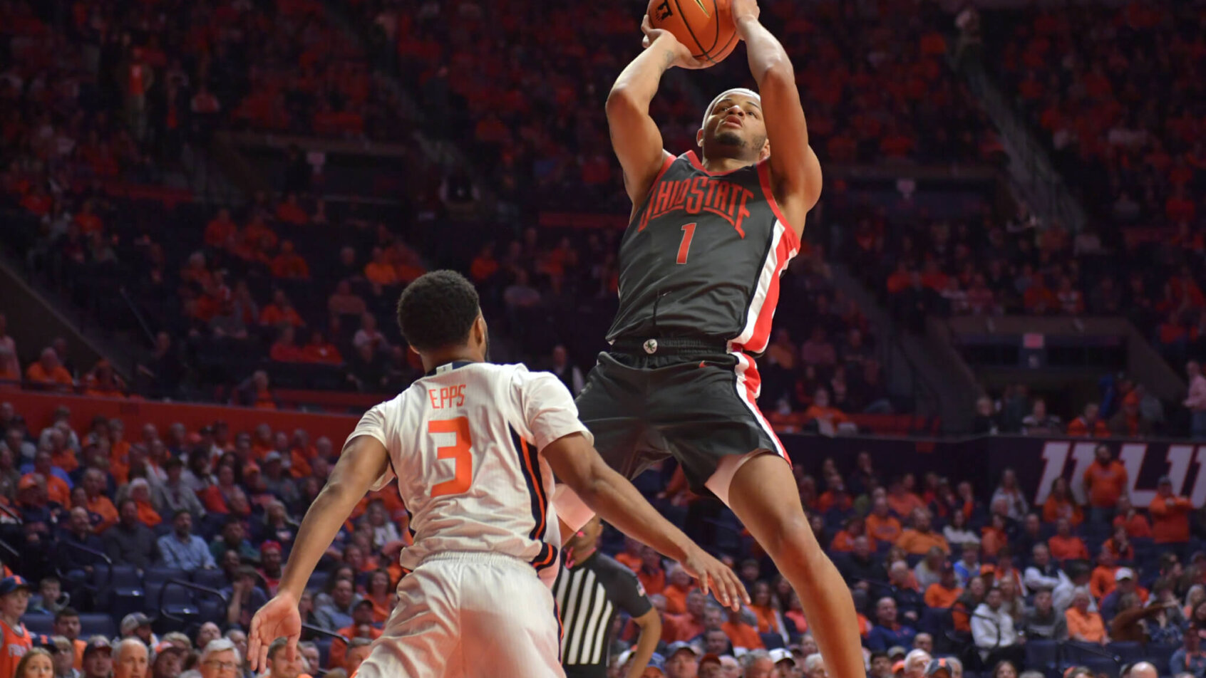 Roddy Gayle Jr. fires a jumper over an Illinois defender