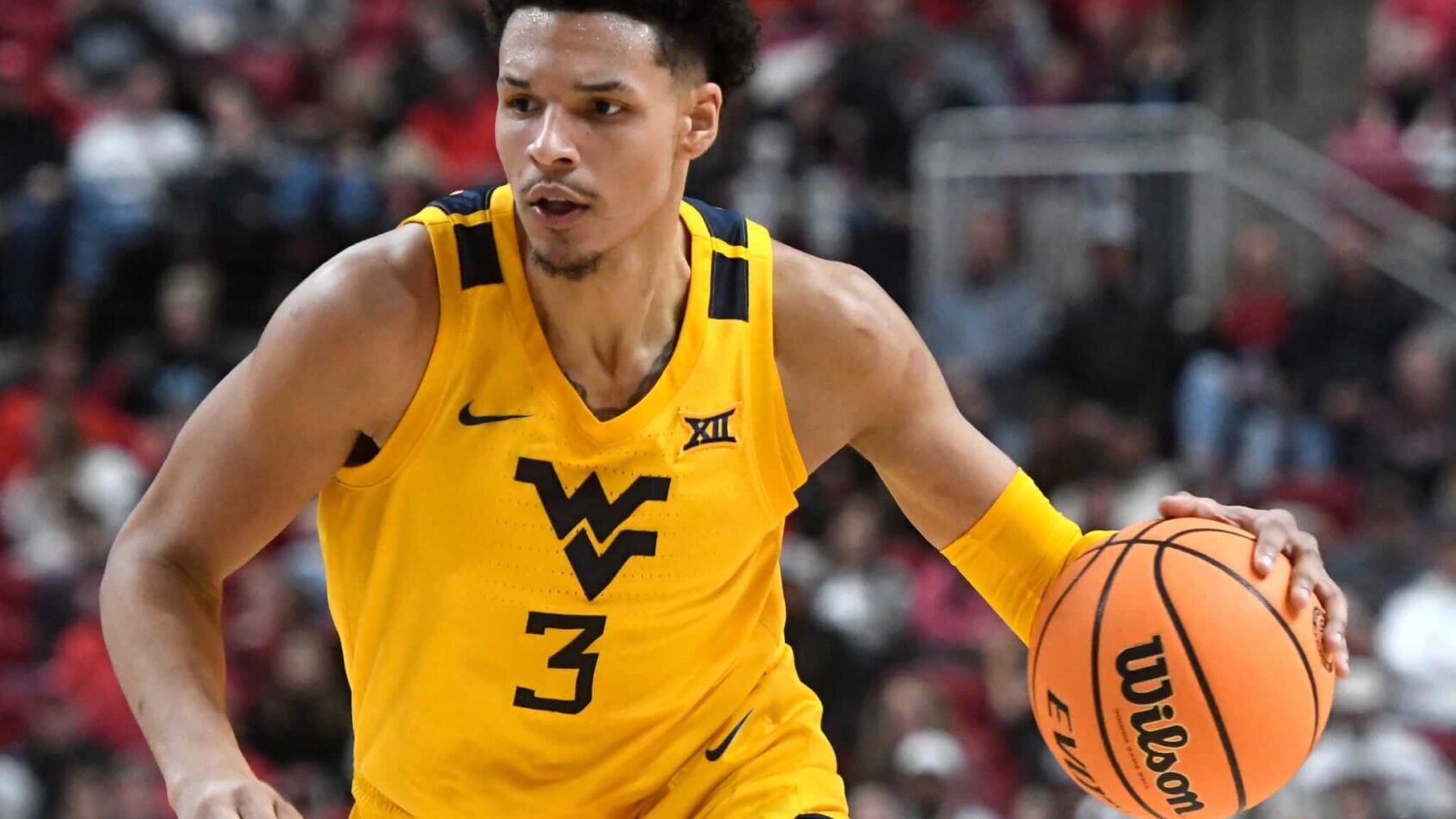 Tre Mitchell drives versus Texas Tech