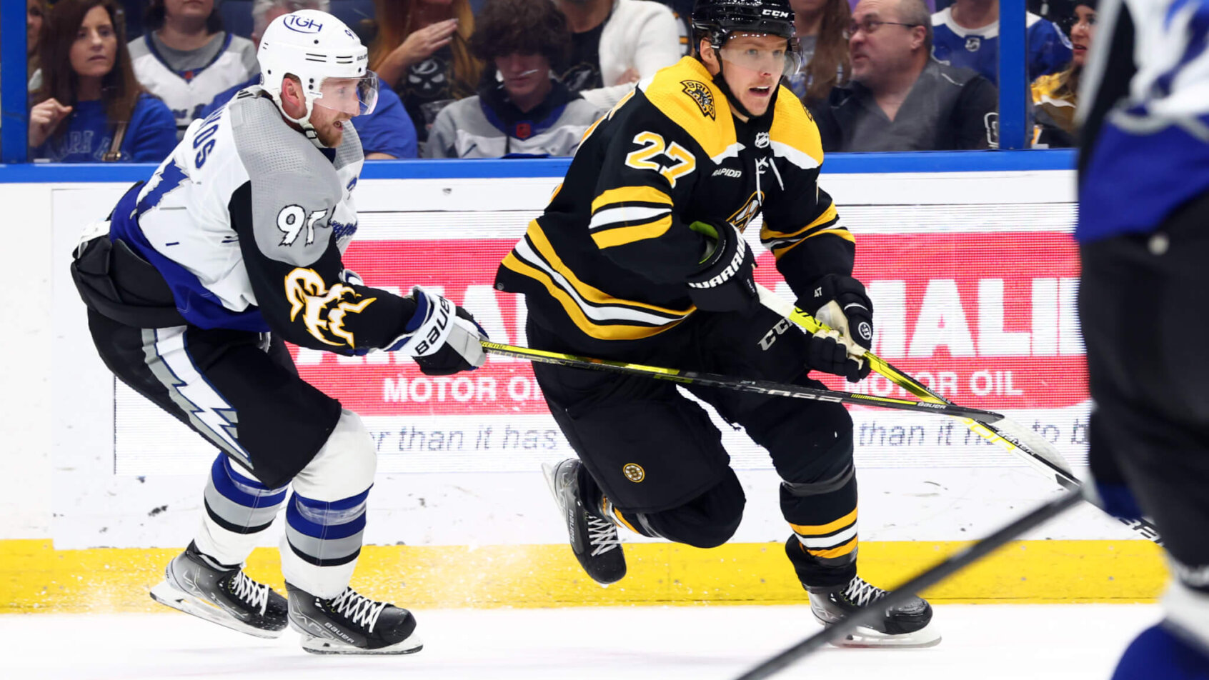 Steven Stamkos of Lightning chasing Bruins Hampus Lindholm