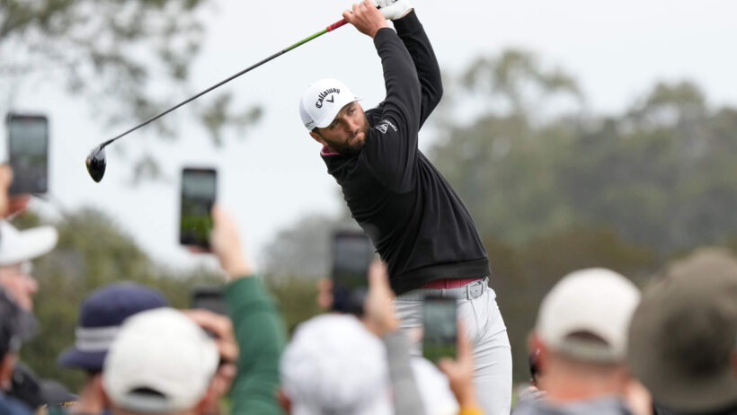 Jon Rahm hits his tee shot