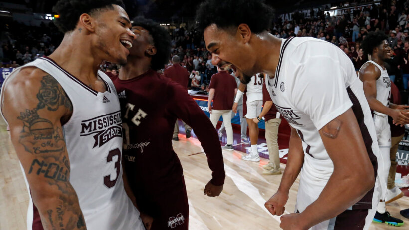 Mississippi State Bulldogs guard Shakeel Moore celebrates with forward Tolu Smith
