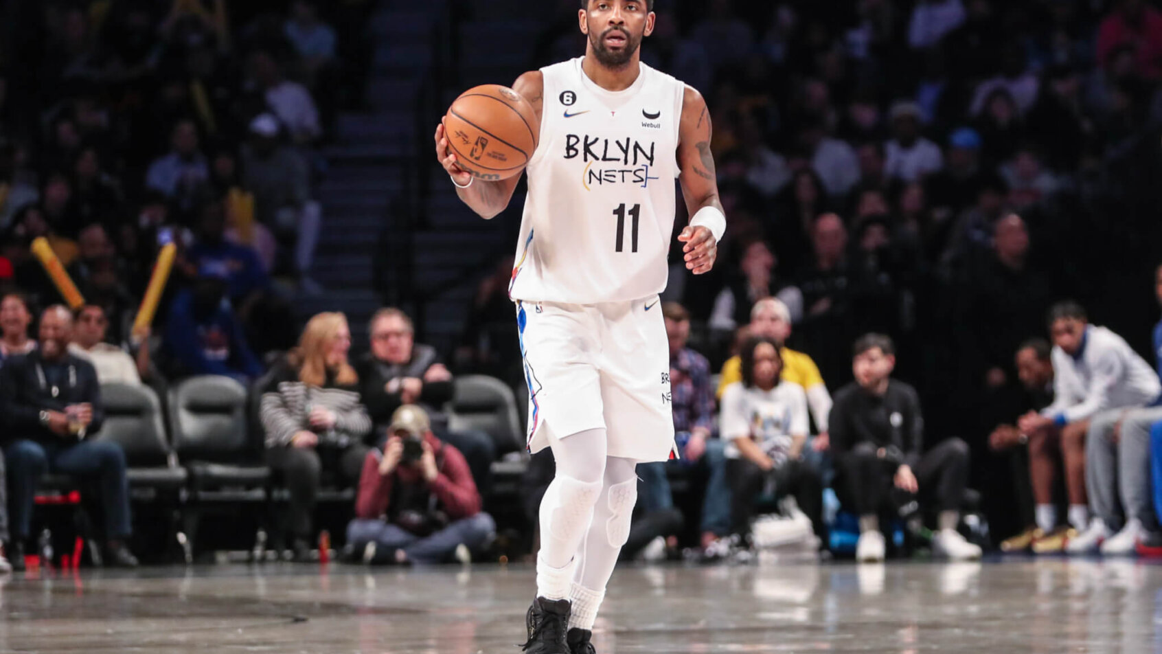 Kyrie Irving brings the ball up court