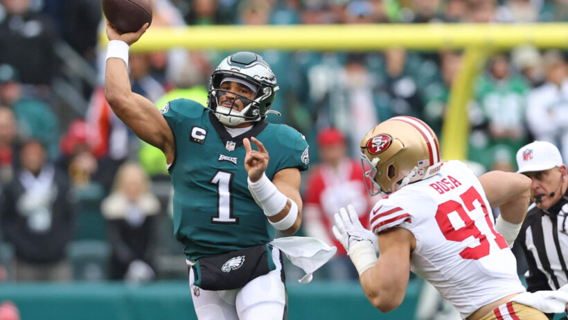 Jalen Hurts throws on the run vs the 49ers