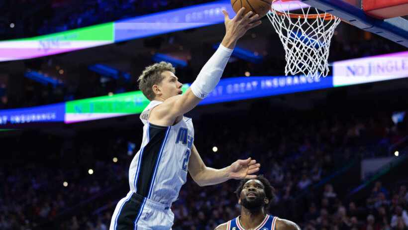 Mo Wagner drives on Joel Embiid in the Magic vs 76ers game