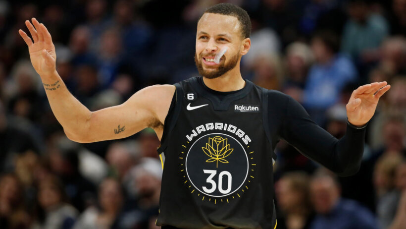 Steph Curry arms out celebrating