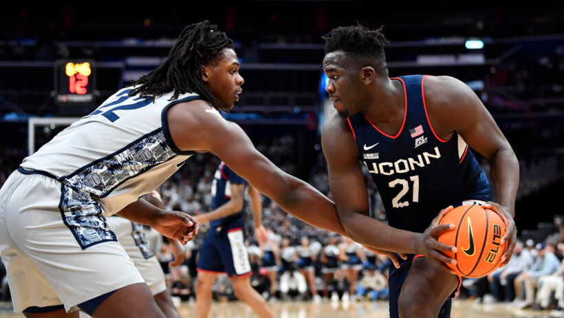 Connecticut Huskies forward Adama Sanogo holds the ball