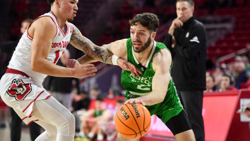 North Dakota’s Matt Norman drives past a defender