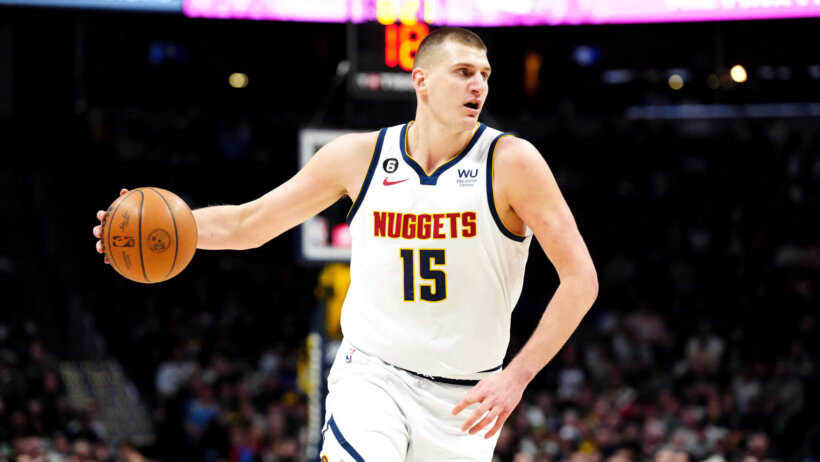 Nikola Jokic brings the ball up court