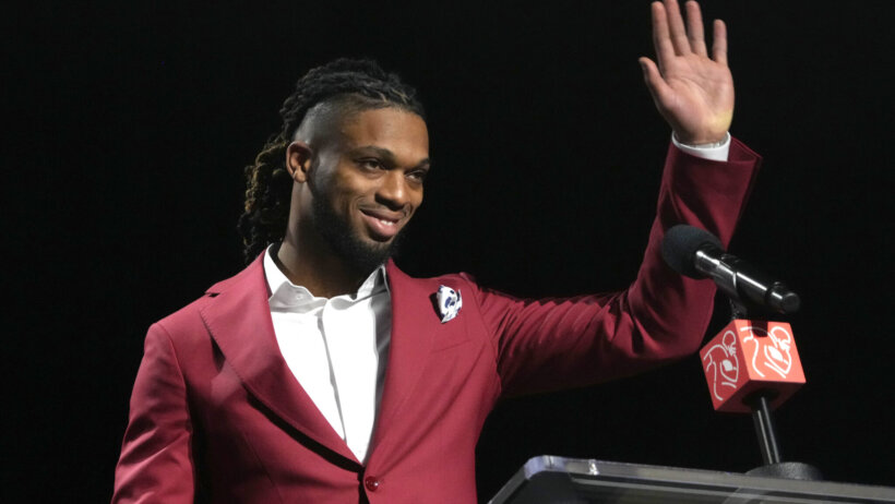 Buffalo Bills safety Damar Hamlin accepts the Alan Page Community Award during the NFLPA press conference at the Phoenix Convention Center.