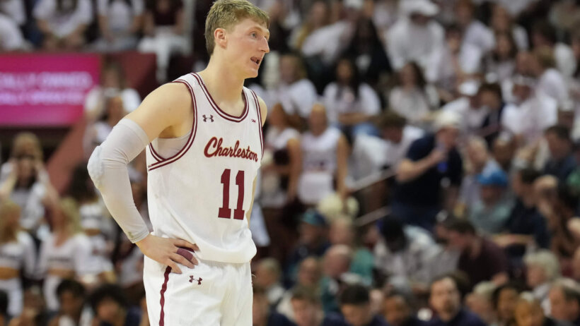 Charleston Cougars guard Ryan Larson stands on the court, hands on hips
