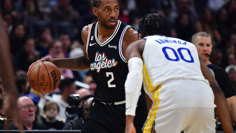 Kawhi Leonard dribbling in front of defender