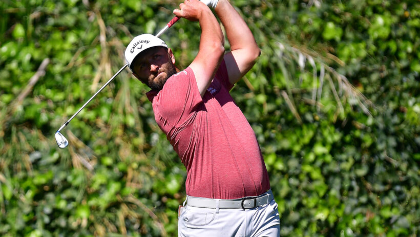 Jon Rahm hits a tee shot