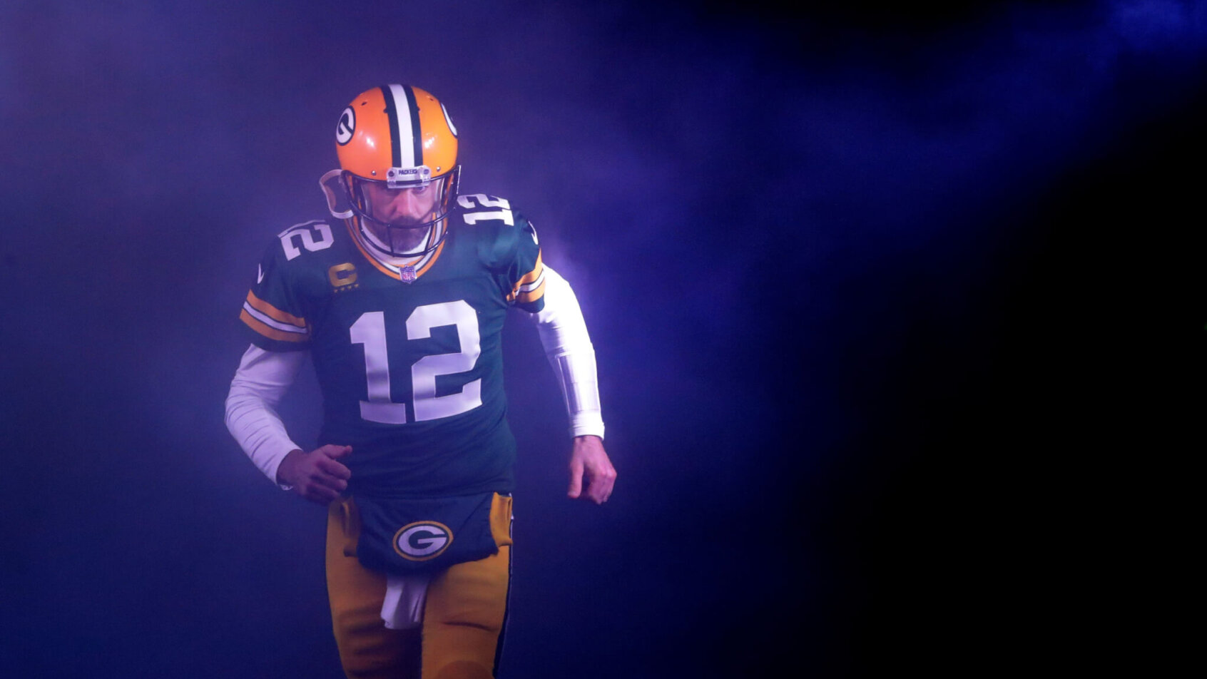 Green Bay Packers quarterback Aaron Rodgers runs out on to the field