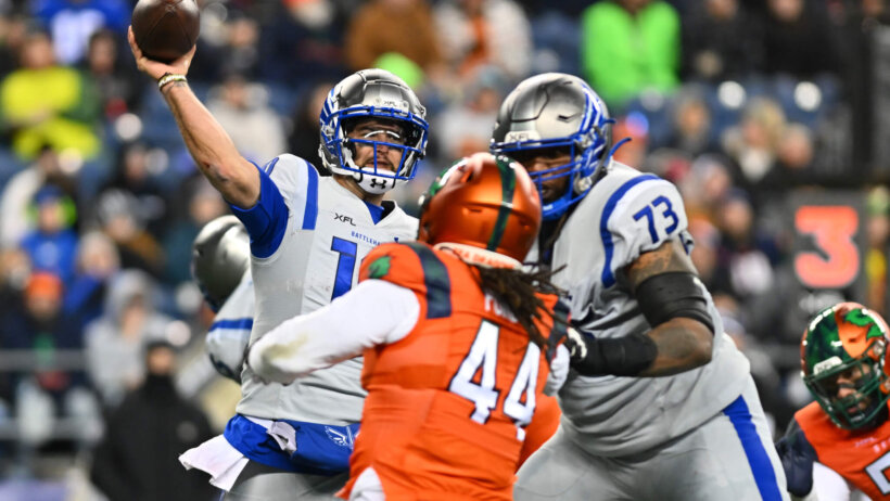 AJ McCarron throws a pass versus Seattle