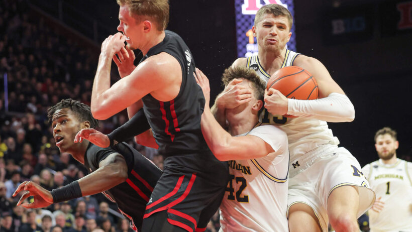 Rutgers and Michigan battle for a loose ball