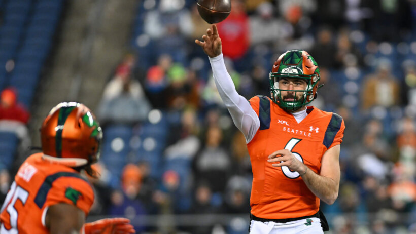 Ben DiNucci tosses a pass to Mogan Ellison