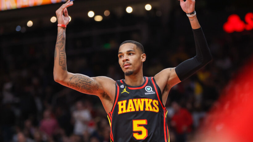 Dejounte Murray arms up signaling three-point make