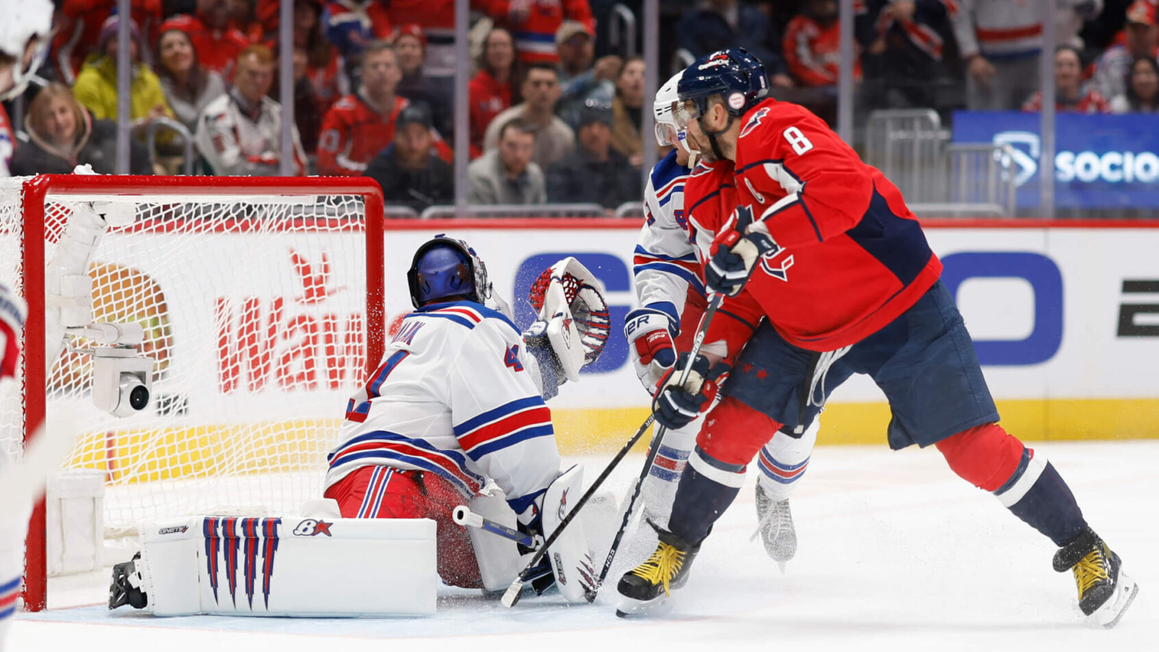 Washington Capitals left wing Alex Ovechkin deflects a shot on New York Rangers goaltender Jaroslav Halak