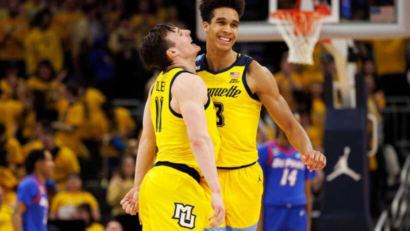 Marquette Golden Eagles forward Oso Ighodaro celebrates with guard Tyler Kolek