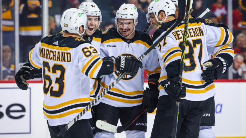 Boston Bruins defenseman Dmitry Orlov celebrates his goal with teammates