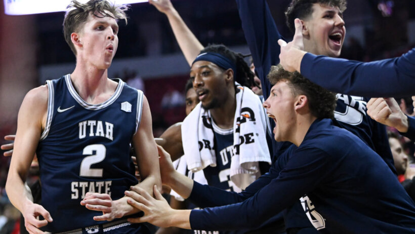Utah State Aggies players celebrate a win