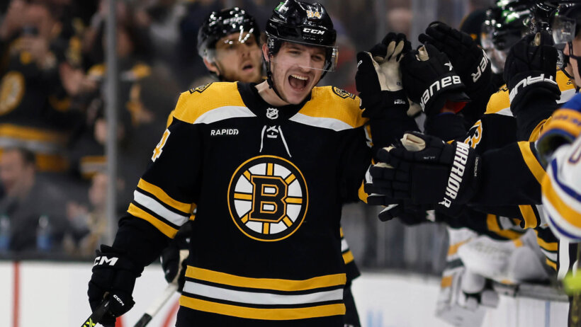 oston Bruins center Jakub Lauko (94) celebrates with teammates
