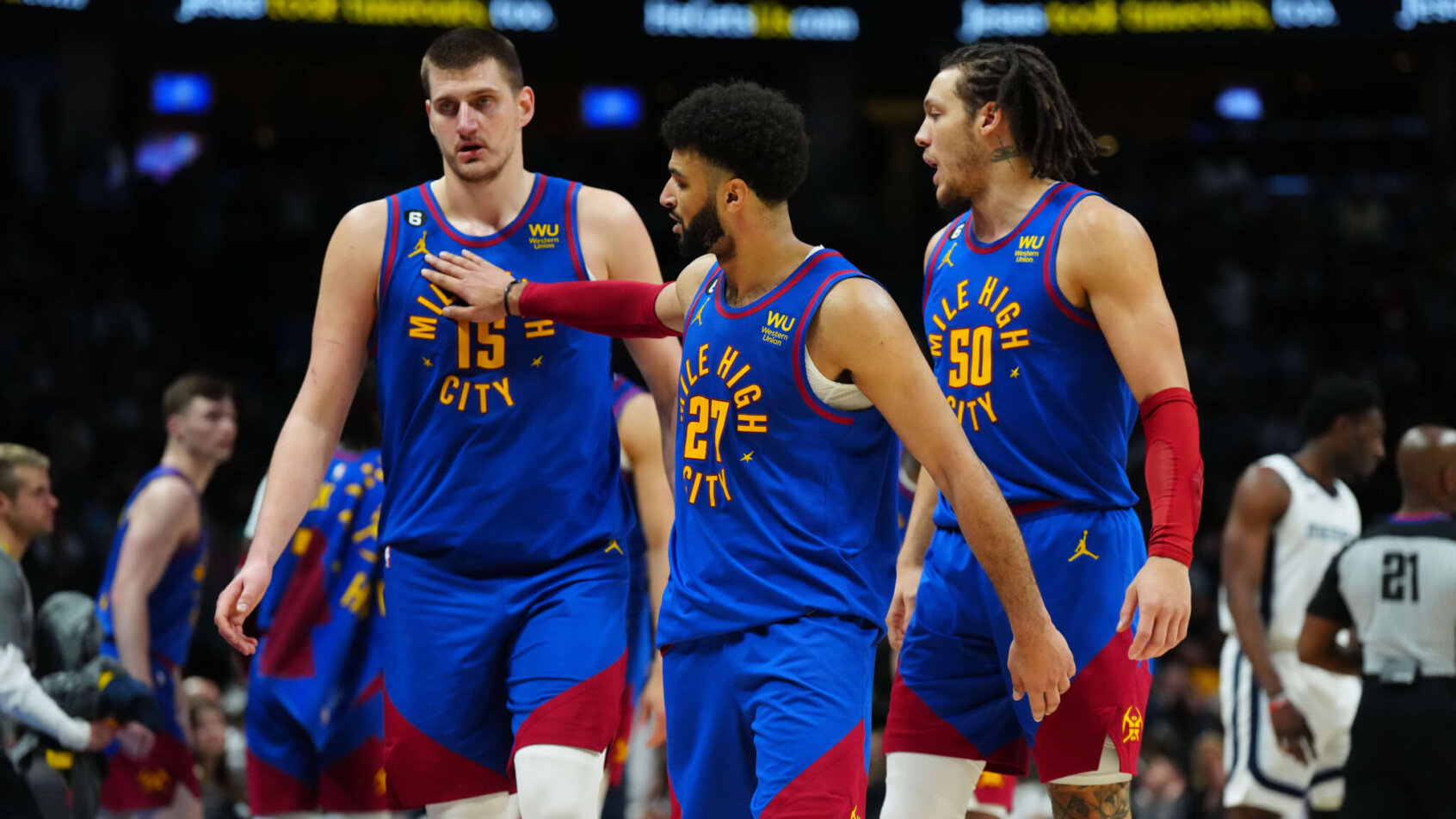 Jamal Murray taps Nikola Jokic on the chest