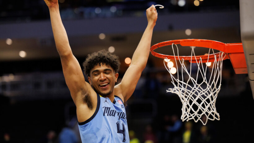 Marquette's Stevie Mitchell cuts down the net
