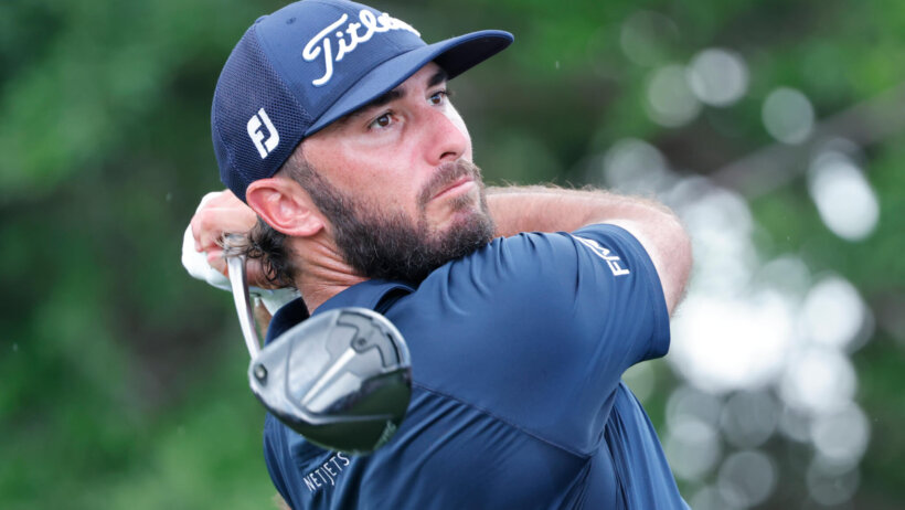 Max Homa watches his drive