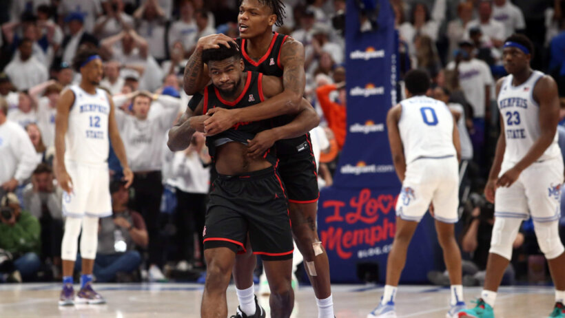 Marcus Sasser celebrates with Jamal Shead