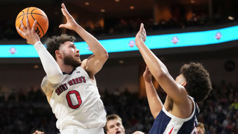 Saint Mary's Gaels guard Logan Johnson shoots over a defender
