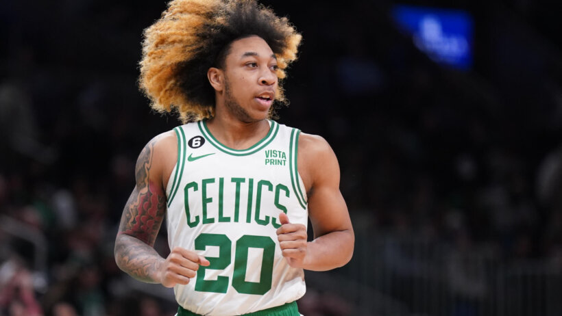 Boston Celtics guard JD Davison running hair flowing white green jersey