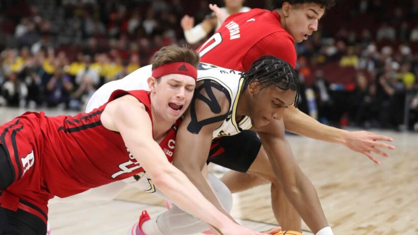 Rutgers players fighting for ball