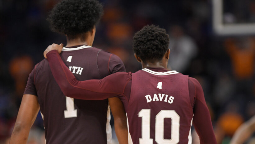 Mississippi State Bulldogs forward Tolu Smith walks with guard Dashawn Davis