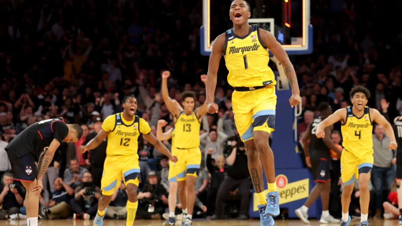Marquette players celebrating win over Connecticut