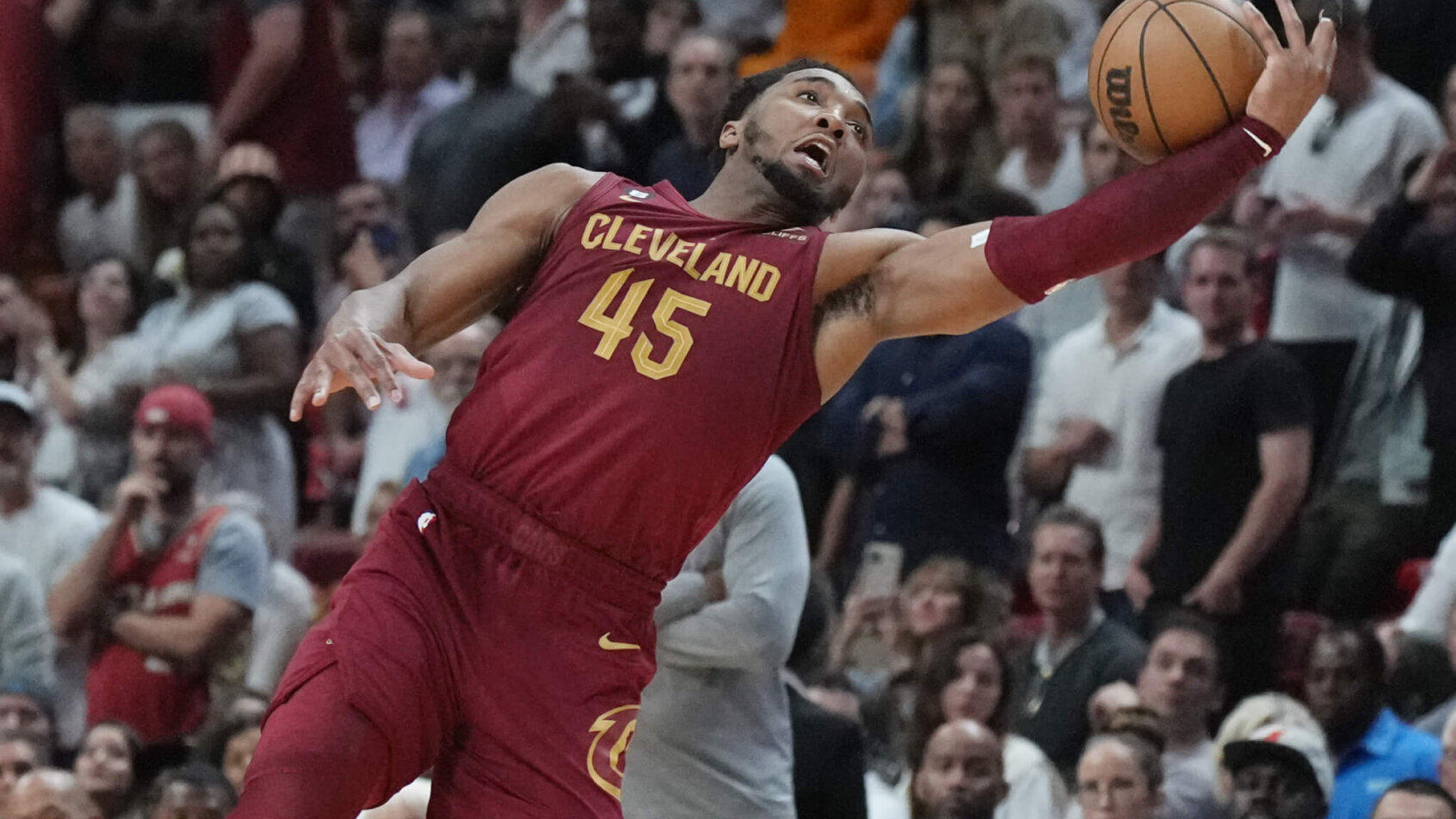Donovan Mitchell reaches for a loose ball