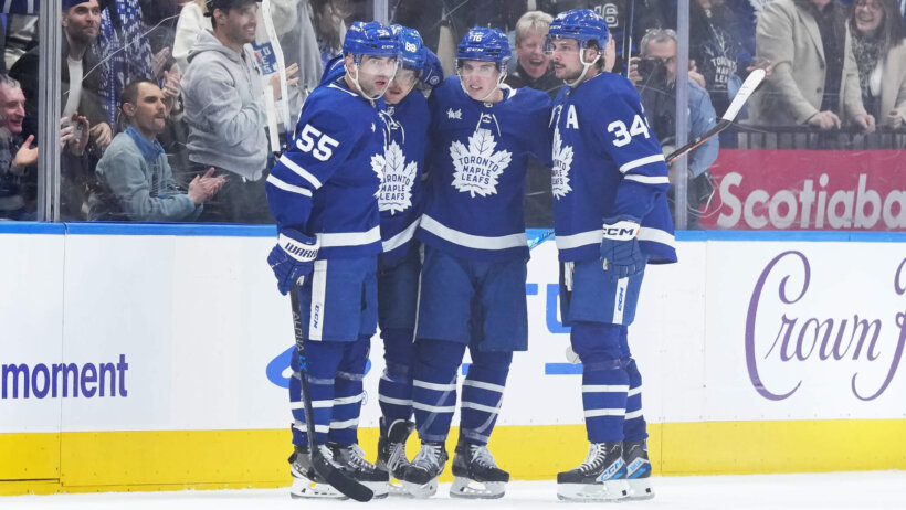 William Nylander, Auston Matthews, and Mitch Marner celebrate a goal