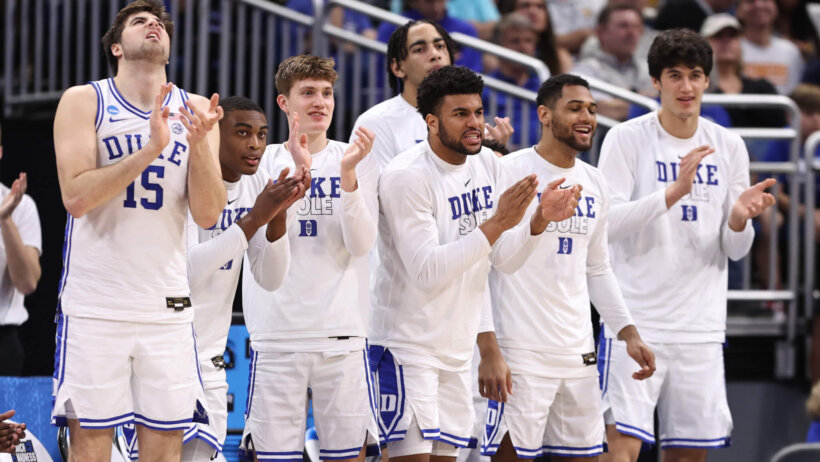 Duke players celebrating win over Oral Roberts