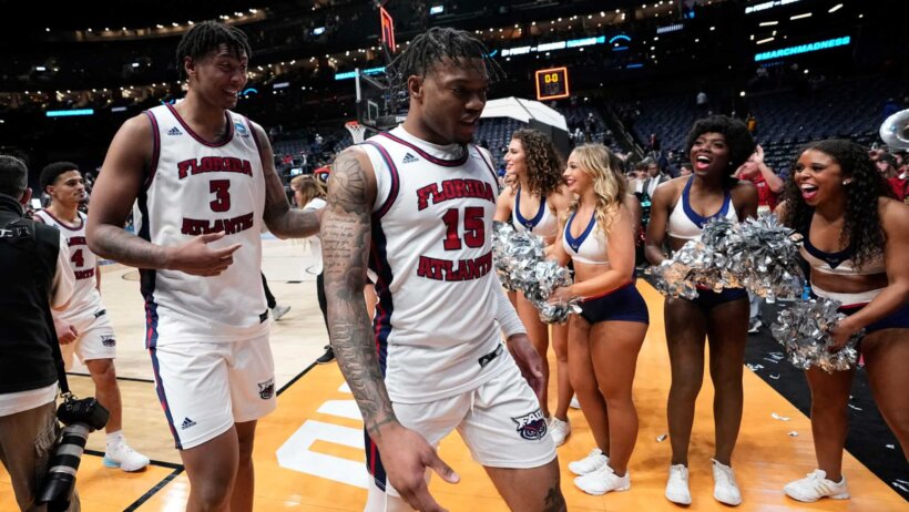 FAU players walking off the basketball court