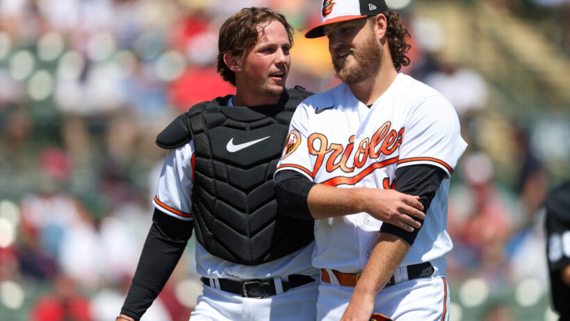 Baltimore Orioles catcher Adley Rutschman talks to starting pitcher Cole Irvin