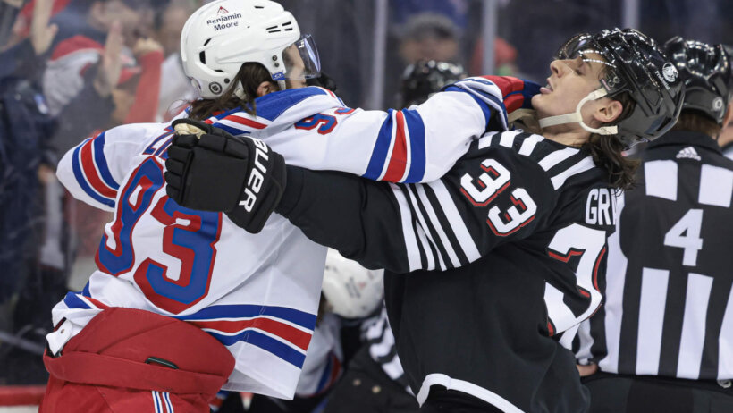 New York Rangers center Mika Zibanejad battles with New Jersey Devils defenseman Ryan Graves