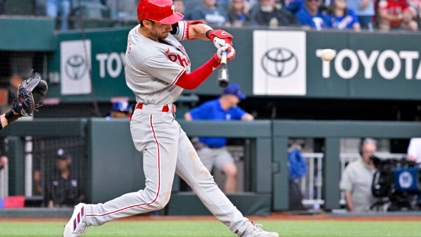 Trea Turner swings at pitch