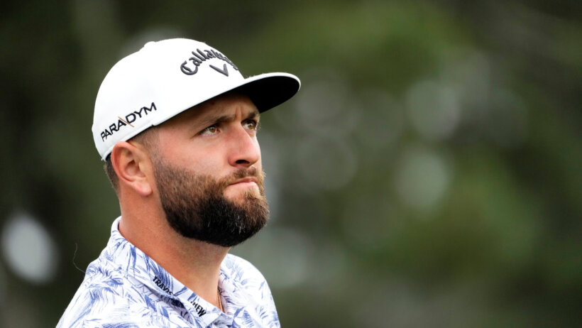 Jon Rahm watches a tee shot