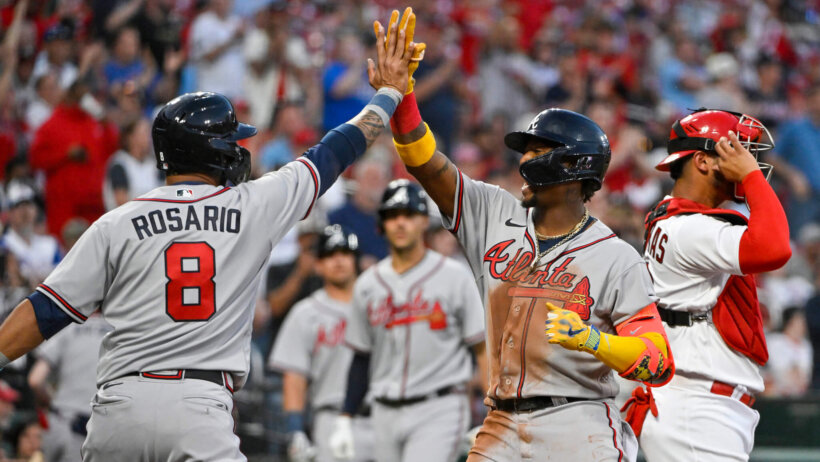 Atlanta Braves right fielder Ronald Acuna Jr. celebrates with left fielder Eddie Rosario